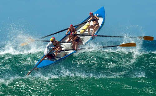 Coffs Harbour’s Open Girls crew clear a big set during the finals of the Hoey Moey North Coast surf boat series at Park Beach on Saturday. Coffs Harbour’s Open Girls crew clear a big set during the finals of the Hoey Moey North Coast surf boat series at Park Beach on Saturday.